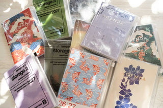 colorful planners for 2027 on a table together