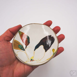 Mini floral ceramic plate held in hand, white base with gold rim and butterfly blossoms