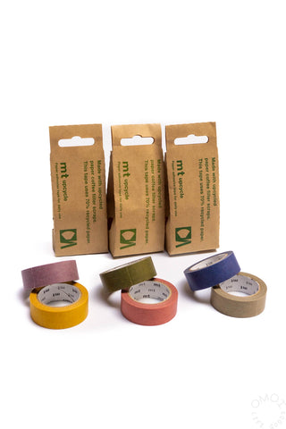Set of recycled colorful tapes with paper packaging on a white background