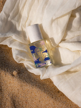 Maison Matine eau de parfum bottle, gold cap, blue illustrated label