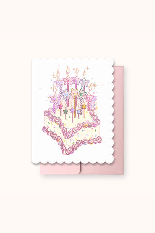 White die-cut greeting card with multicolor wish lettering and candle illustration