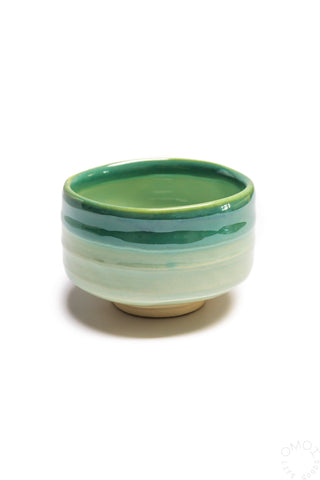 Seafoam ceramic matcha bowl with green rim and smooth curved sides