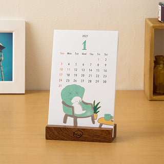2027 desk calendar stand with dog-themed illustration and wooden base