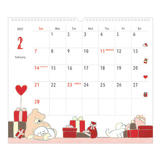 2027 wall calendar close-up with dog illustrations and gift boxes along bottom