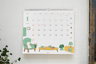 Hanging 2027 wall calendar featuring illustrated dogs, weekly grid and dates