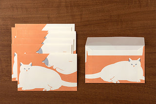 Set of stationery envelopes with cat illustrations on an orange background
