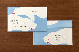 Envelope set with polar bear design on a wooden surface
