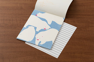 Letter pad with polar bear design on a wooden surface