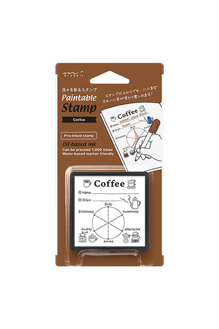 Paintable stamp set with coffee-themed design in packaging on a white background