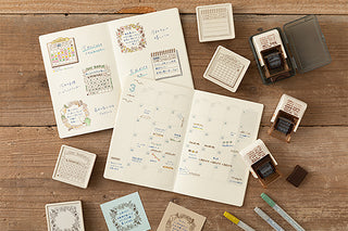 Paintable block stamp set with multiple stamp pads and memo pages