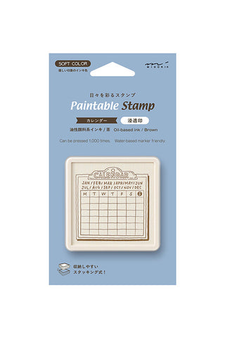 Paintable calendar block stamp in beige base, shown on retail package blister