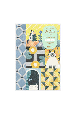 Notebook with cat illustrations on a geometric patterned cover