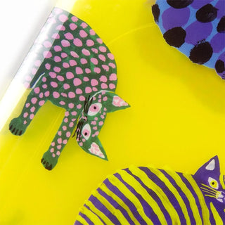 Colorful cat illustrations on a yellow background