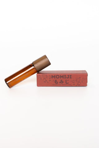 Momiji skin scent next to red packaging on a white background