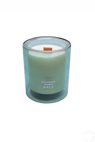 Light green candle in a glass container with 'MIYASHIRO STUDIO' branding on a white background