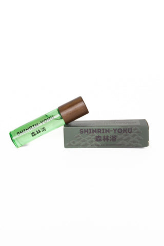 Shinrin-Yoku skin scent bottle next to packaging on a white background