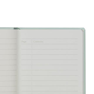 Mint green hard cover notebook, open inside view with page lines and “Content”