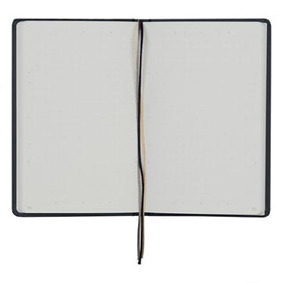 Open hard cover dot grid notebook with ribbon bookmark and blank right page