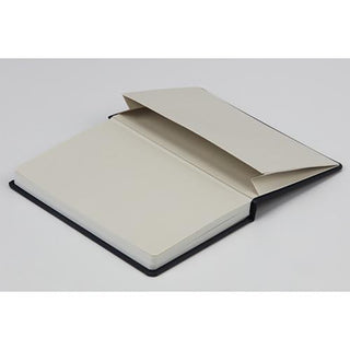 Closed hard cover notebook with cream pages and black edge binding