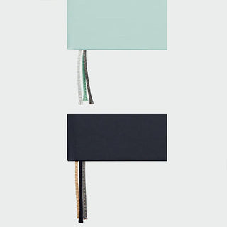 Hard cover dot grid notebook in mint and navy colors with tassel tie