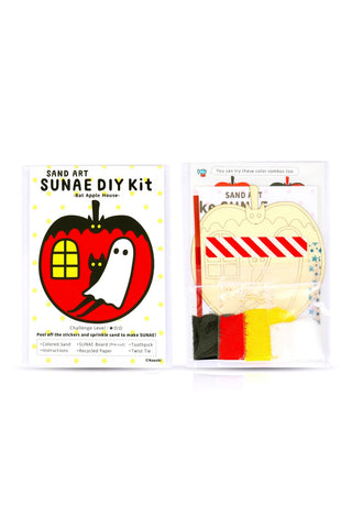 Sand art DIY kit in blister pack with bat-and-house stencil and colored sand pieces