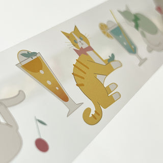 Washi tape with a cat and cocktail design on a white background
