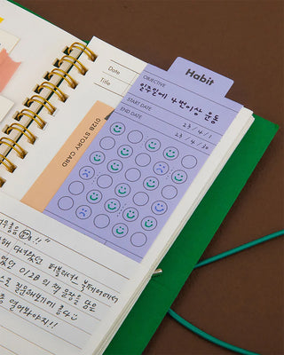 Habit tracker memo tag inside of notebook 