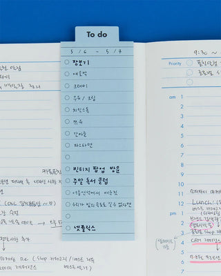 To-do memo with dates and to-do list inside of a planner
