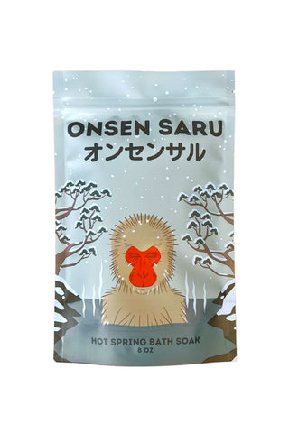 Onsen Saru hot spring bath soap packaging with a monkey illustration on a light blue background