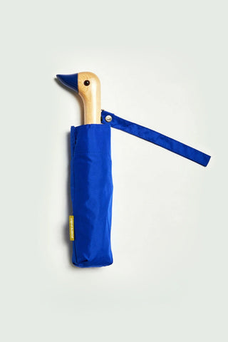 Blue umbrella with wooden duck handle on a white background