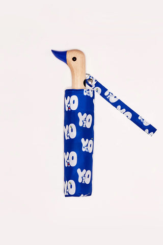Blue umbrella with duck shaped wooden beak and Snoopy pattern with "YO" text