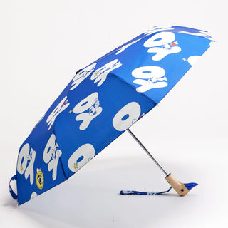 Blue umbrella with white 'Yo' text and Snoopy pattern on a white background
