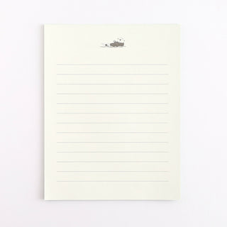 Lined pages with a small otter illustration on a white background