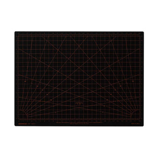 A black rectangular cutting mat with a red grid, angle guides, and measurement markings, shown flat against a white background.
