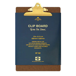 A clipboard with a dark blue packaging, brown wood, and a gold metal clip at the top, shown on a plain white background.