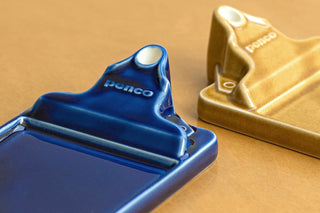 Two Penco ceramic incense holders in the shape of clipboards shown in a close-up shot