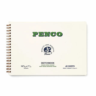 A Penco sketchbook with a cream-colored cover, green 'PENCO' logo, and double spiral binding on a white background.