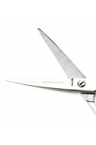 Small stainless steel scissors close-up with textured blades and metal finger rings.