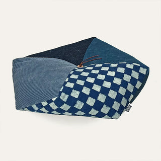 Indigo patchwork cushion with blue checkered panel and striped side panels, tied detail