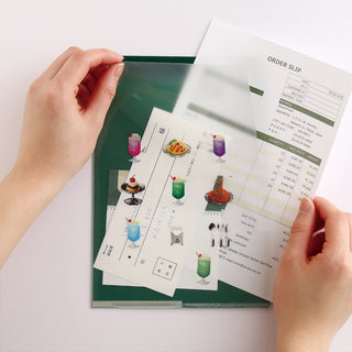 Person inserting paper into folder with food design