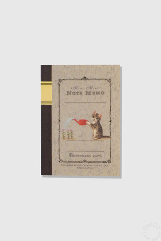 Notebook with cat illustration on a beige background