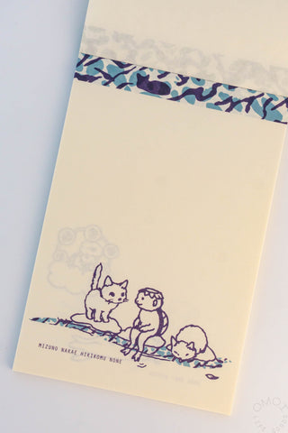 Memo pad with illustrations of cats and a kappa on a beach