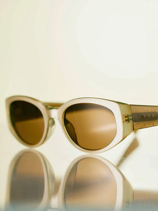 RAEN Kwela close-up: sage opal frame with tinted brown lenses