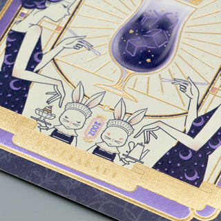 Decorative card with artistic illustrations of women, rabbits, and a dessert glass on a purple and gold background.