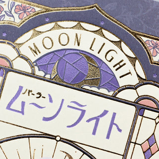Decorative post card with 'MOON LIGHT' text and Japanese characters on a patterned background