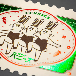 Post card with cartoon bunnies and text on a green and white background