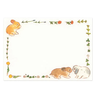 Note card with rabbit illustrations and decorative border on a white background
