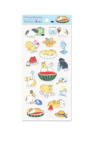 Sheet of cute rabbit and summerthemed stickers on a white background.