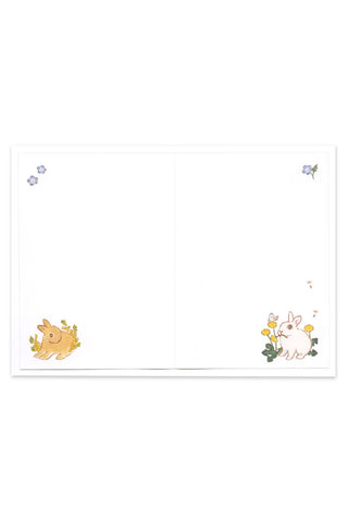 Open rabbit greeting card with small flowers and colorful animal illustrations
