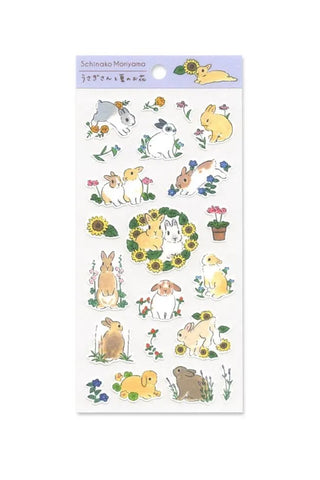 Sheet of decorative stickers with cartoon rabbits and nature elements on a white background.